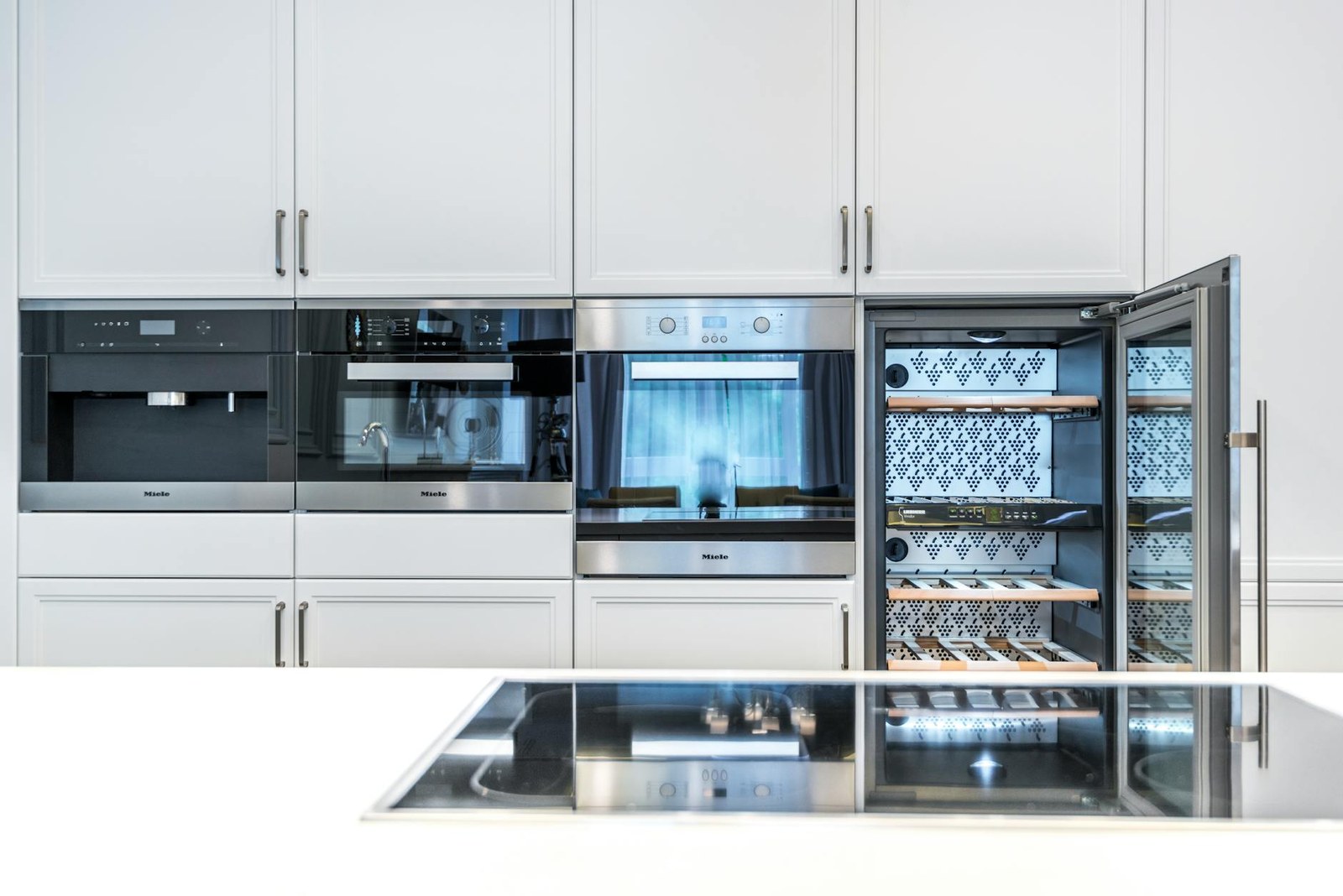 Integrated fridge and dishwasher concealed behind matching cabinet doors in an Adelaide kitchen renovation