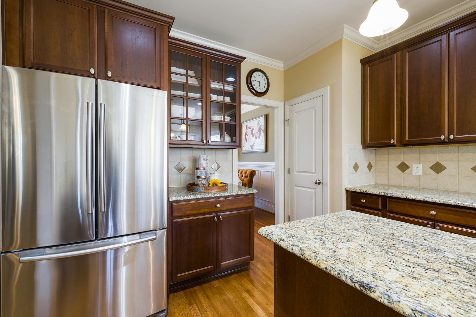Kitchen cabinet refacing before and after — old timber doors replaced with two-pack white in an Adelaide renovation
