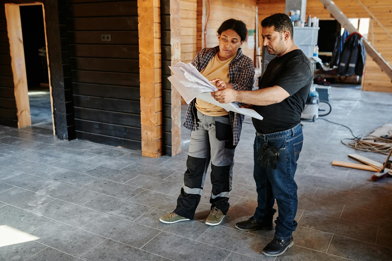Adelaide kitchen renovation contractor reviewing project plans on-site with a homeowner