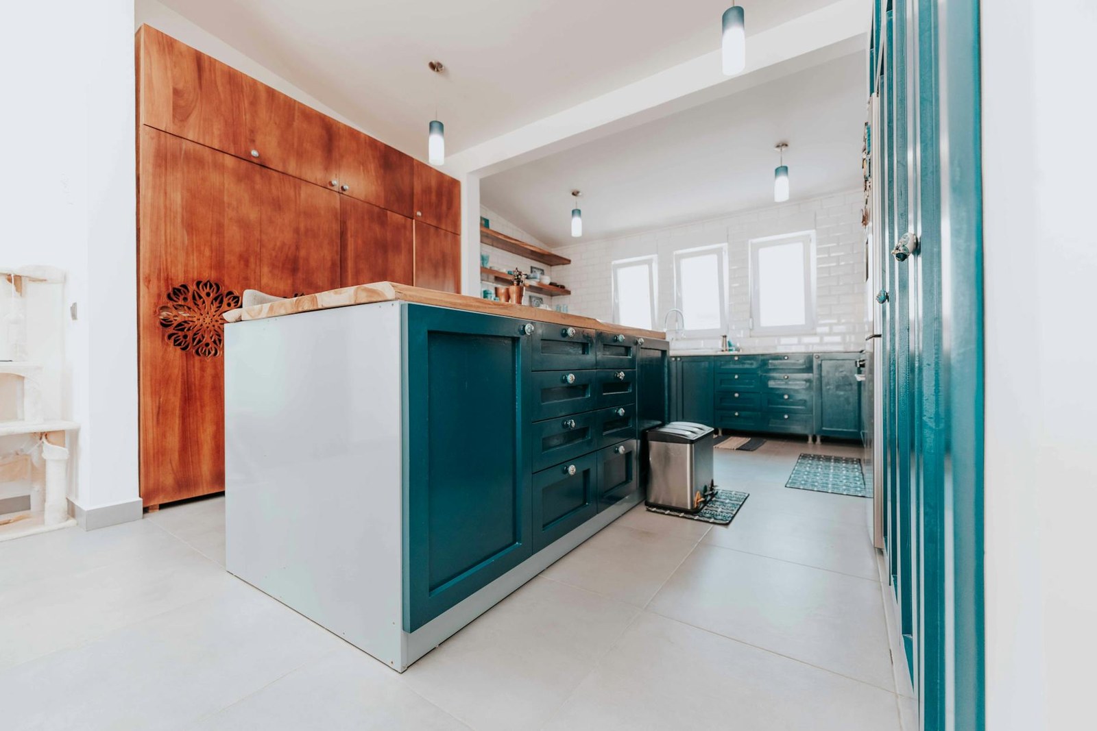 Modern kitchen design with handleless two-tone cabinetry, integrated appliances and stone benchtop in an Adelaide home
