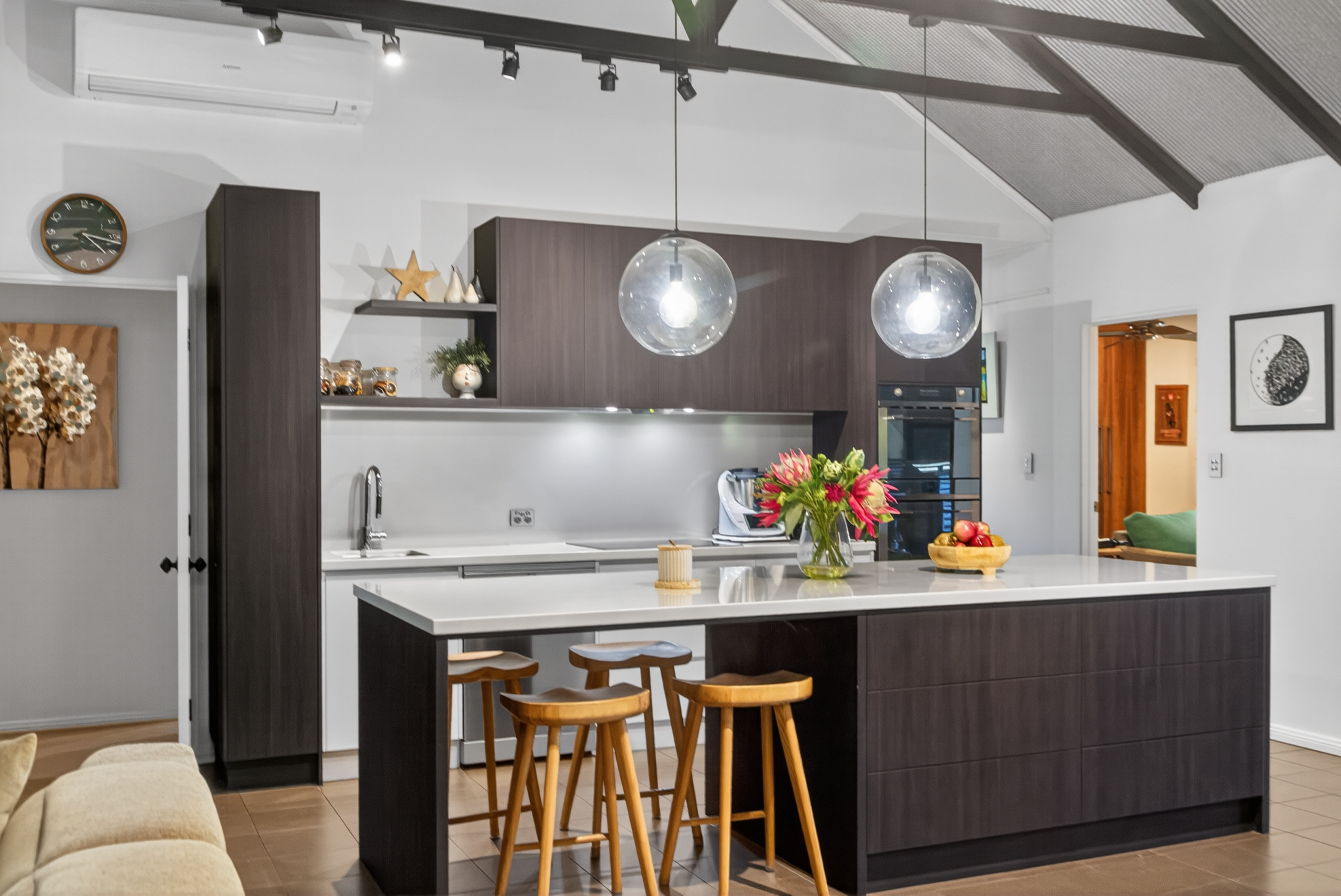 Adelaide walk-through butler's pantry with stone benchtop and floor-to-ceiling shelving in a renovated kitchen